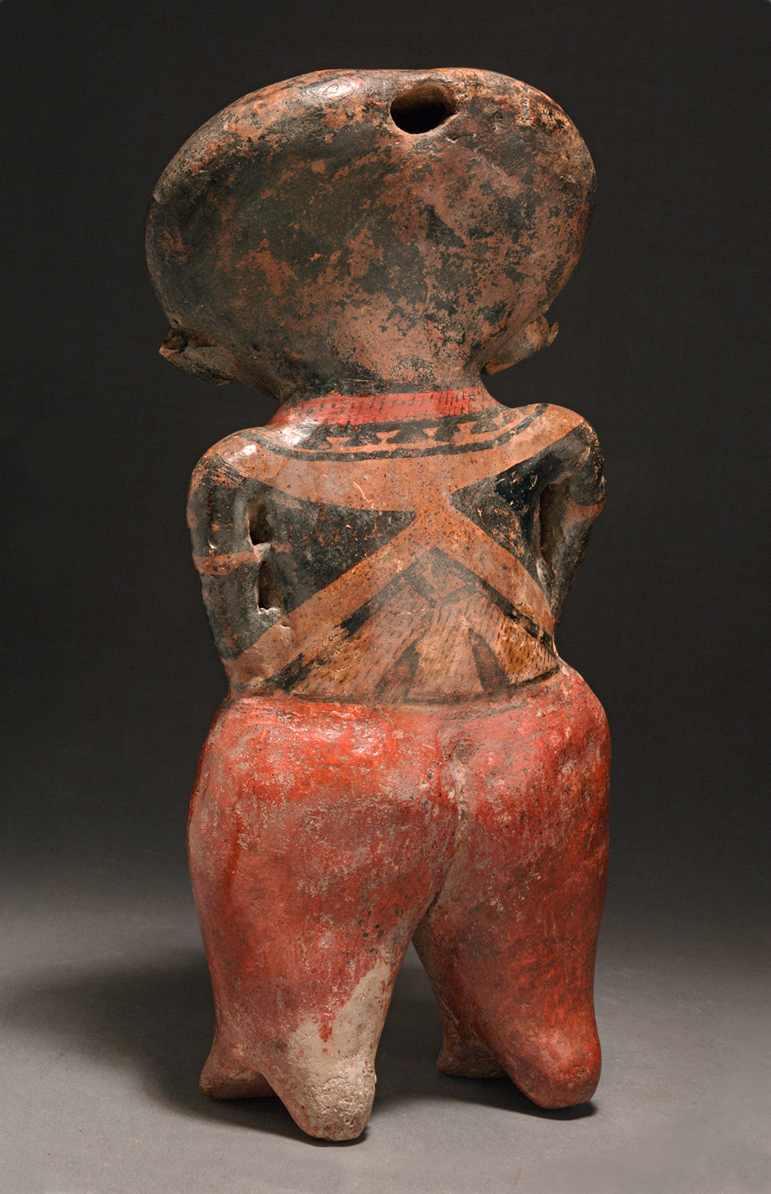 Chinesco standing female holding a baby 4