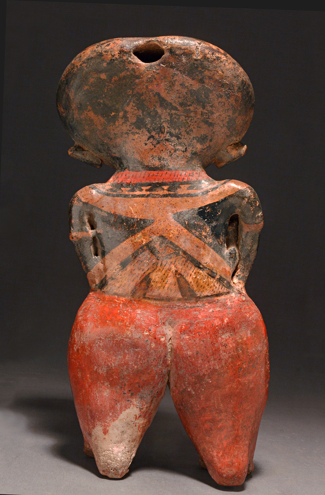 Chinesco standing female holding a baby 5
