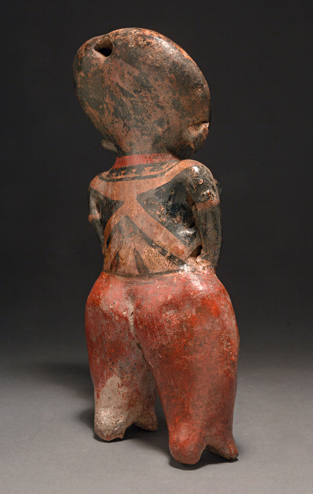 Chinesco standing female holding a baby 6